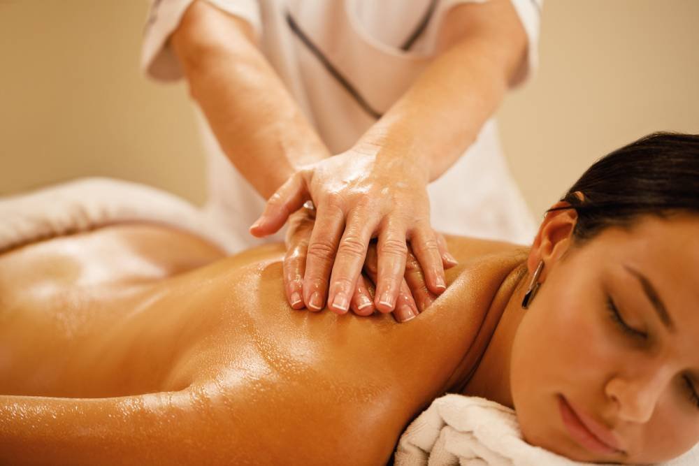 closeup-woman-relaxing-back-massage-spa-salon (1)
